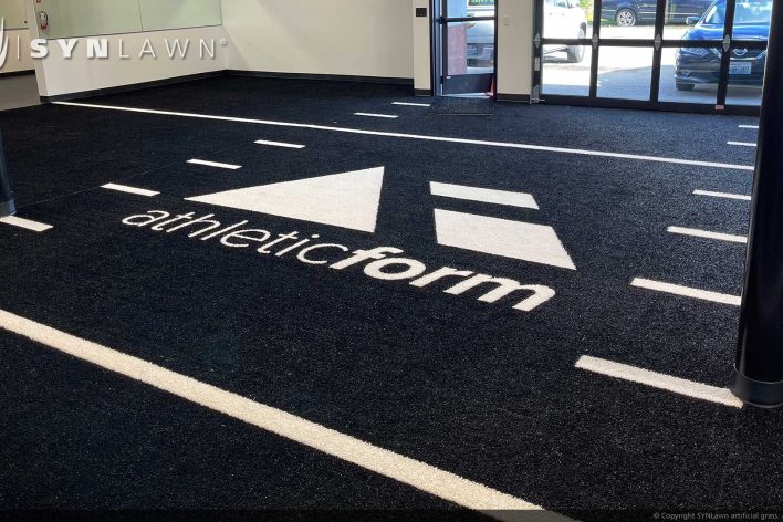 image of SYNLawn Windsor CA prefab turf logos for athletic weight room applications